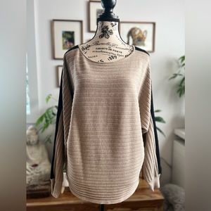 Cyrus soft sweater. In tan with black stripes at sleeves. Medium.
